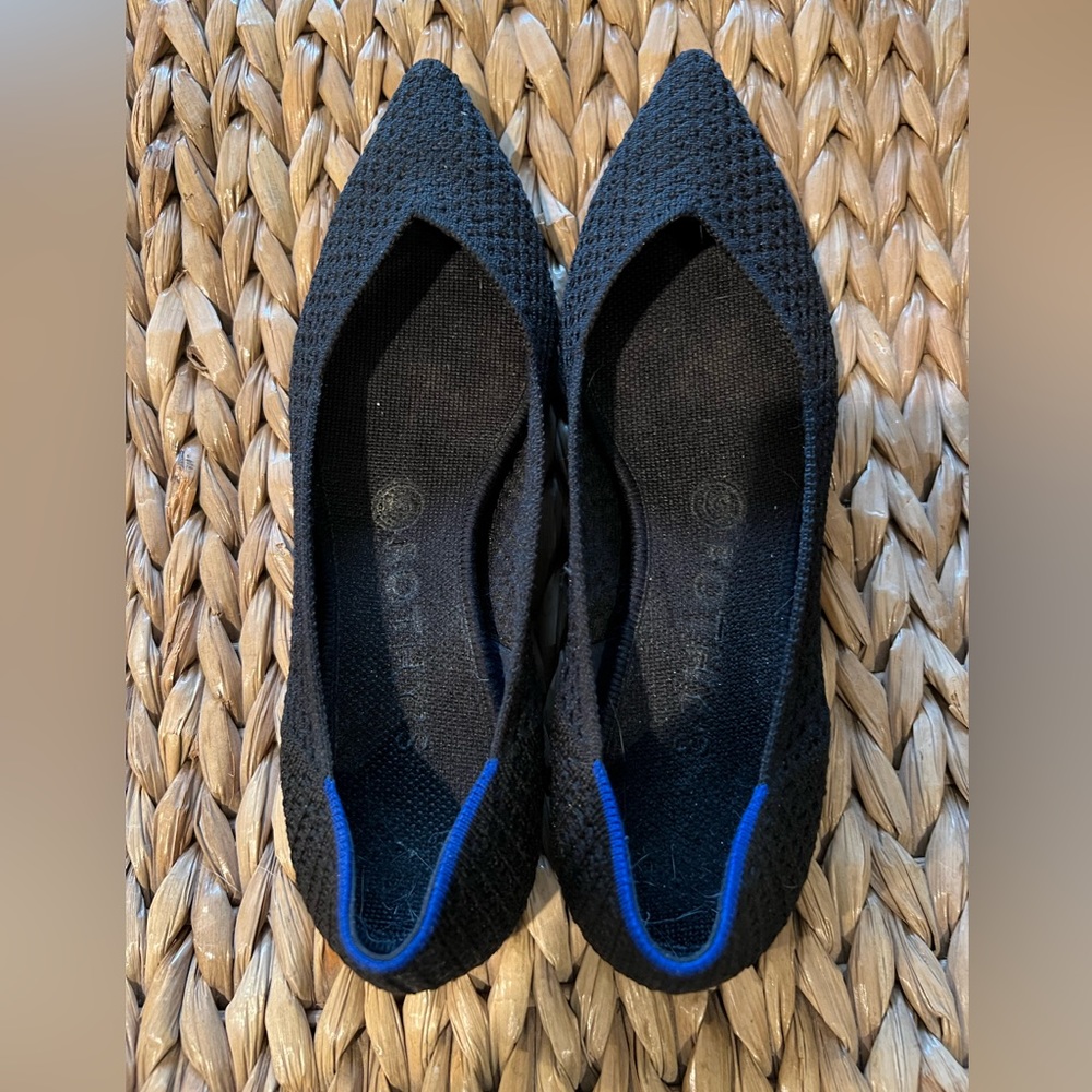 Black Rothy’s pointed flats.